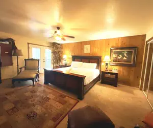 Photo 5 - Lake view three bedroom, three bath log-sided cottage with private hot tub overlooking Lake Ouachita. by RedAwning