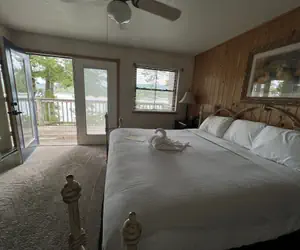 Photo 4 - Lake view two bedroom, two bath loft, log-sided cottage with private hot tub overlooking Lake Ouachita. by RedAwning