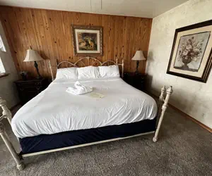 Photo 3 - Lake view two bedroom, two bath loft, log-sided cottage with private hot tub overlooking Lake Ouachita. by RedAwning