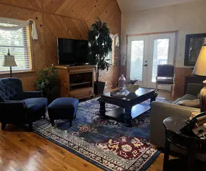 Photo 2 - Lake view two bedroom, two bath loft, log-sided cottage with private hot tub overlooking Lake Ouachita. by RedAwning