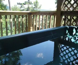 Photo 2 - C16, Two bedroom, two bath, log-sided Harbor North luxury cottage with hot tub overlooking Lake Ouachita. by RedAwning