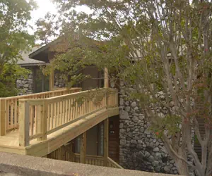 Photo 2 - Forest view, log-sided two bedroom, two bath condo on Lake Ouachita. by RedAwning