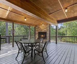 Photo 3 - CozyCentralCabin | Hot Tub| Fire Pit| Pets Welcome