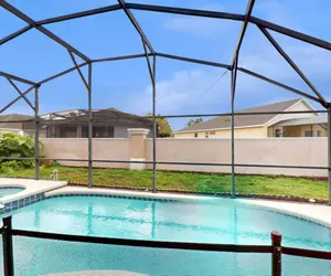 Photo 5 - 15 Min to Disney | Spacious 4BR Home w/ Pool