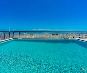 Photo 4 - Ocean View Balcony just STEPS to the Beach with Pool, Parking and Wi-Fi!