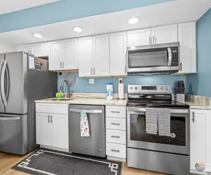 Photo 3 - Spectacular Ocean View STEPS from the Beach and Pool! 4th Floor Studio!