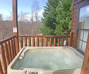 Photo 2 - Paw Prints Secluded Mountain View Cabin with Hot Tub and Pool Table