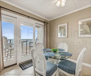 Photo 4 - Coast View Condo Featuring Large Windows Overlooking the Beach