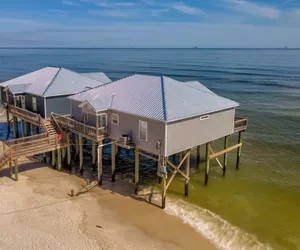 Photo 2 - Rainbows End - GULF FRONT!  Enjoy the sun on your shoulders while you laze on the deck.