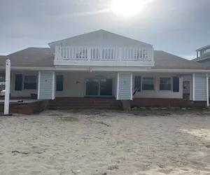 Photo 3 - Roomy Beachfront Apartment with Deck and Game Room