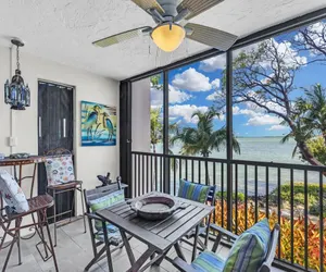 Photo 4 - Beautiful End Unit with water views from all windows overlooks the Bay and Tropical Beach Setting