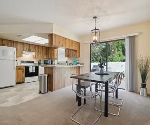 Photo 2 - Sunny Retreat - Spacious Yard, Firepit, & Grill