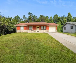 Photo 3 - Sunny Retreat - Spacious Yard, Firepit, & Grill