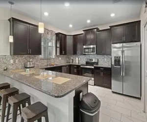 Photo 4 - Luxurious 6BR Villa in Champions Gate | Pool, Spa & Near Disney