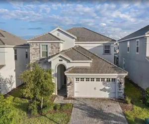 Photo 3 - Luxurious 6BR Villa in Champions Gate | Pool, Spa & Near Disney