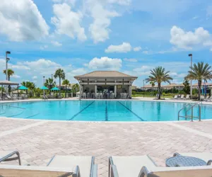 Photo 2 - Luxury 5BR Villa Near Disney | Pool & Golf Retreat
