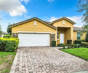 Photo 2 - Luxury 5BR Waterfront Retreat w/ Pool, Hot Tub & Game Room Near Disney
