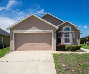 Photo 2 - Cozy 4BR Pool Home w/ Game Room Near Disney