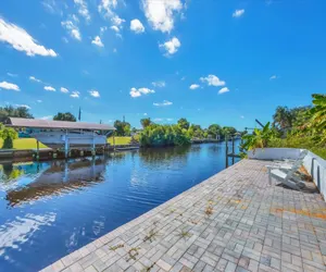 Photo 3 - Harbor Heights Private Pool Vacation Home on Canal with BBQ and Dock