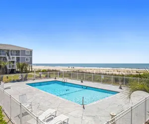 Photo 5 - Fun times and tan lines. Beach front with pool!