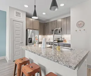 Photo 2 - Airy 1BR King Suite Close to Downtown w Fast Wifi