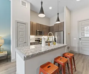 Photo 3 - Grand 1BR King Suite Close to Downtown w Fast Wifi