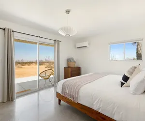 Photo 3 - Relax In Style At The Green Jackrabbit - Hot Tub, Record Player 1 Bedroom Home by RedAwning