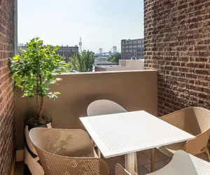 Photo 2 - Sosuite 2BR Apt w Balcony W D Gym On-site Bar