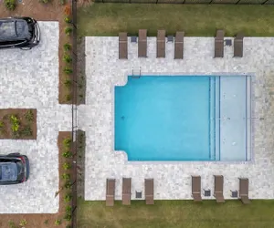 Photo 3 - Rooftop Deck w/ Ocean View, Pool, Walk to Beach! Coastal Canopy by Avantstay