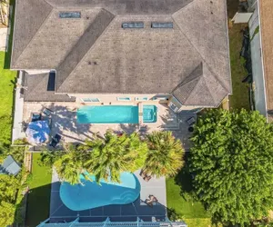 Photo 4 - Sleeps 18! Pool, Hottub, Game Room, Blocks to Beach Vilano Villa by Avantstay