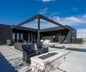 Photo 3 - Luxe Modern Escape w Pool Hot Tub Firepit Desert View Lassen by Avantstay