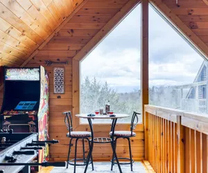 Photo 2 - Cozy Cabin Hot Tub Balcony Golf Simulator Near Pigeon Forge Smoky Mountain Group Retreat Mountains Are Calling by Avantstay