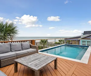 Photo 2 - Oceanfront w Pool Panoramic Deck Views 5bdr Folly Ocean Breeze by Avantstay