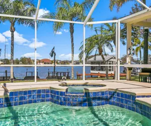 Photo 5 - Luxe Waterfront Hideaway w Pool & Pirate Ship Dock