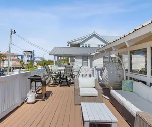 Photo 2 - Beach Retreat w/ Sundeck, Golf Cart & Bikes Bungalow House by Avantstay