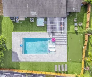 Photo 2 - Pool, Hot Tub & Putting Green Near Deerfield Beach Oasis on Fourth by Avantstay