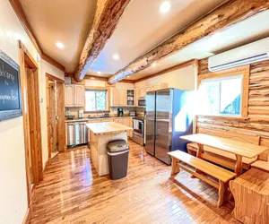 Photo 2 - Log cabin with fireplace, minutes from skiing, snowmobiling, xc ski, and more!