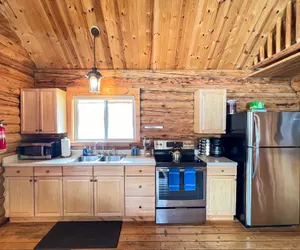 Photo 3 - Perfect log cabin with fireplace near skiing, snowmobiling, and more!