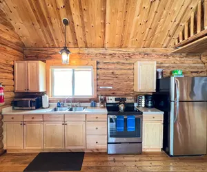 Photo 5 - Perfect log cabin with fireplace near skiing, snowmobiling, and more!