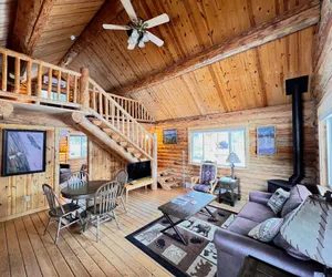 Photo 2 - Perfect log cabin with fireplace near skiing, snowmobiling, and more!