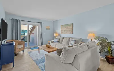 The Coastal Nest: Steps from the Beach and Poolside Relaxation