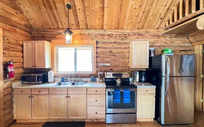 Photo 5 - Perfect log cabin with fireplace near skiing, snowmobiling, and more!