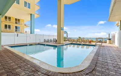 Photo 2 - Beachfront Bliss: Luxe 3BR Condo at Marisol Complex