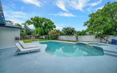 Photo 3 - Palm Harbor Pool 4BR | Hot Tub + BBQ + Game Room