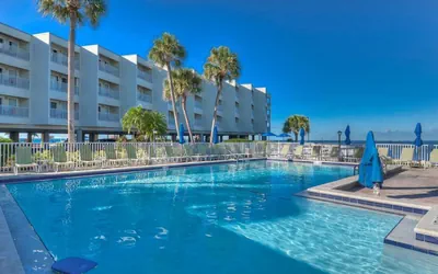 Photo 2 - 311 · Sophisticated Waterfront Getaway: Pool, Balcony, and Serene Views