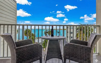 Photo 4 - Elegant Waterfront Condo with Heated Pool