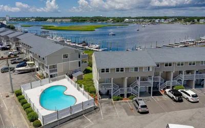 Photo 3 - Canal-Front Townhome | Private 30’ Boat Slip | Pool | 1-Min Walk to Beach