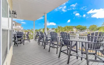 Photo 3 - 🌅 Luxury Waterfront Home in Ocean Lakes | Sleeps 10 | 2 Golf Carts | Lakefront Deck