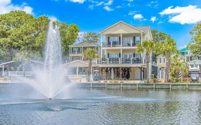 Photo 2 - 🌅 Luxury Waterfront Home in Ocean Lakes | Sleeps 10 | 2 Golf Carts | Lakefront Deck