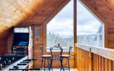 Photo 2 - Cozy Cabin Hot Tub Balcony Golf Simulator Near Pigeon Forge Smoky Mountain Group Retreat Mountains Are Calling by Avantstay